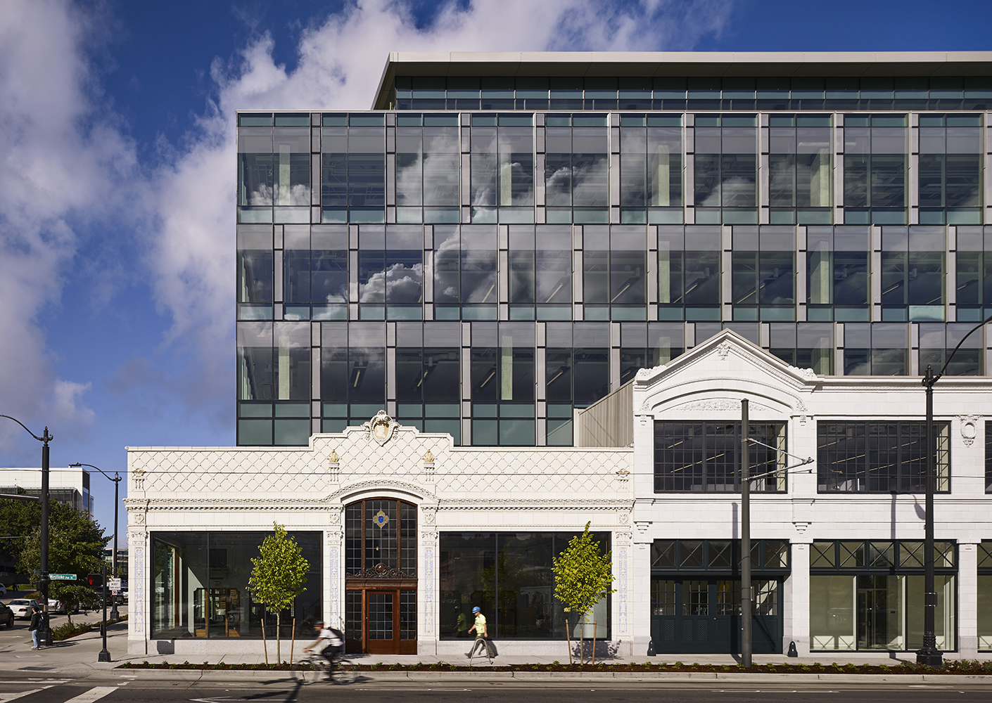 Exterior view of the Allen Institute with cyclist biking past.