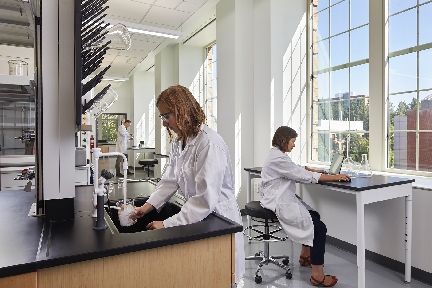Teaching lab with students working and views to outside through large windows