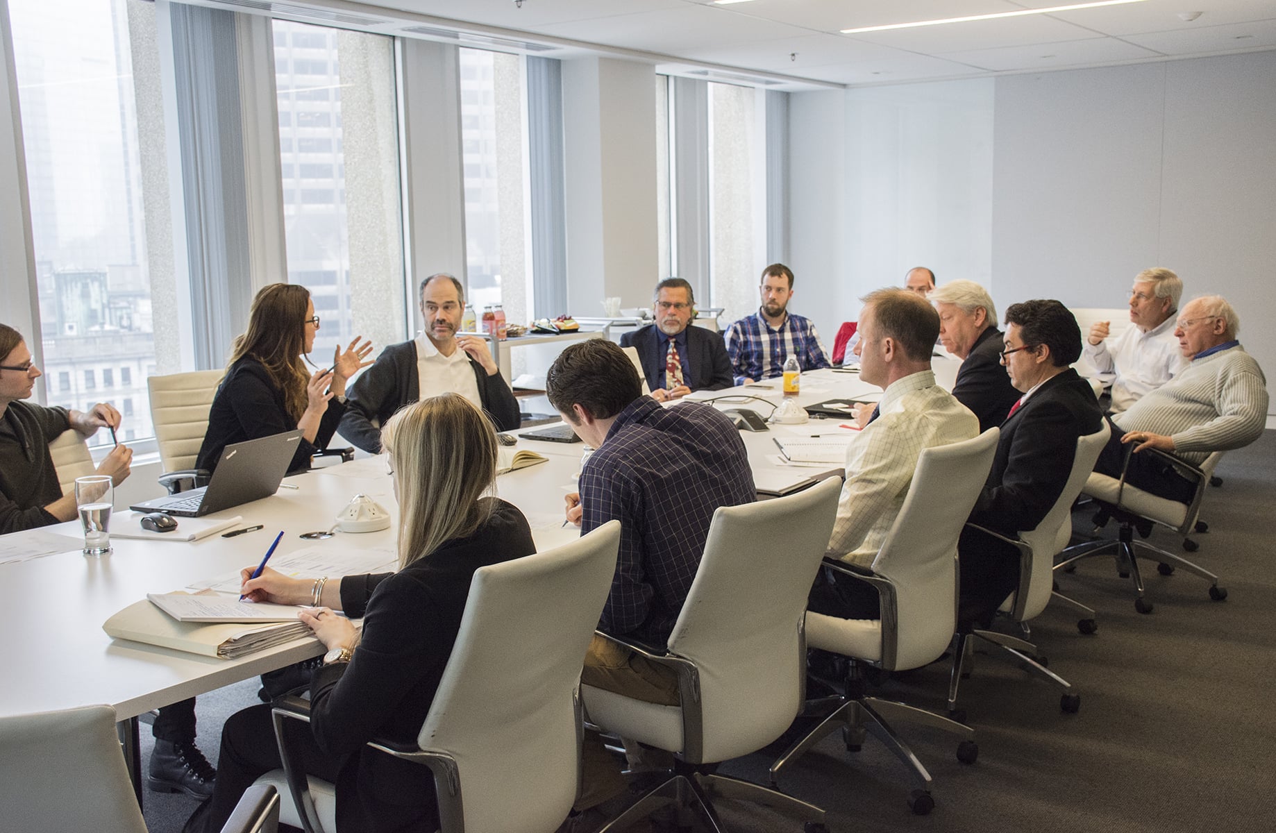 Brooke Trivas leads a large project meeting in the Boston studio.
