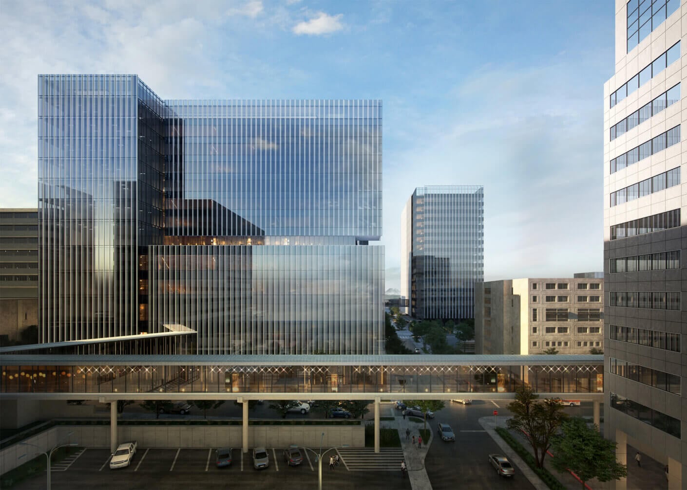 Modern glass skyscraper with skybridge in urban setting