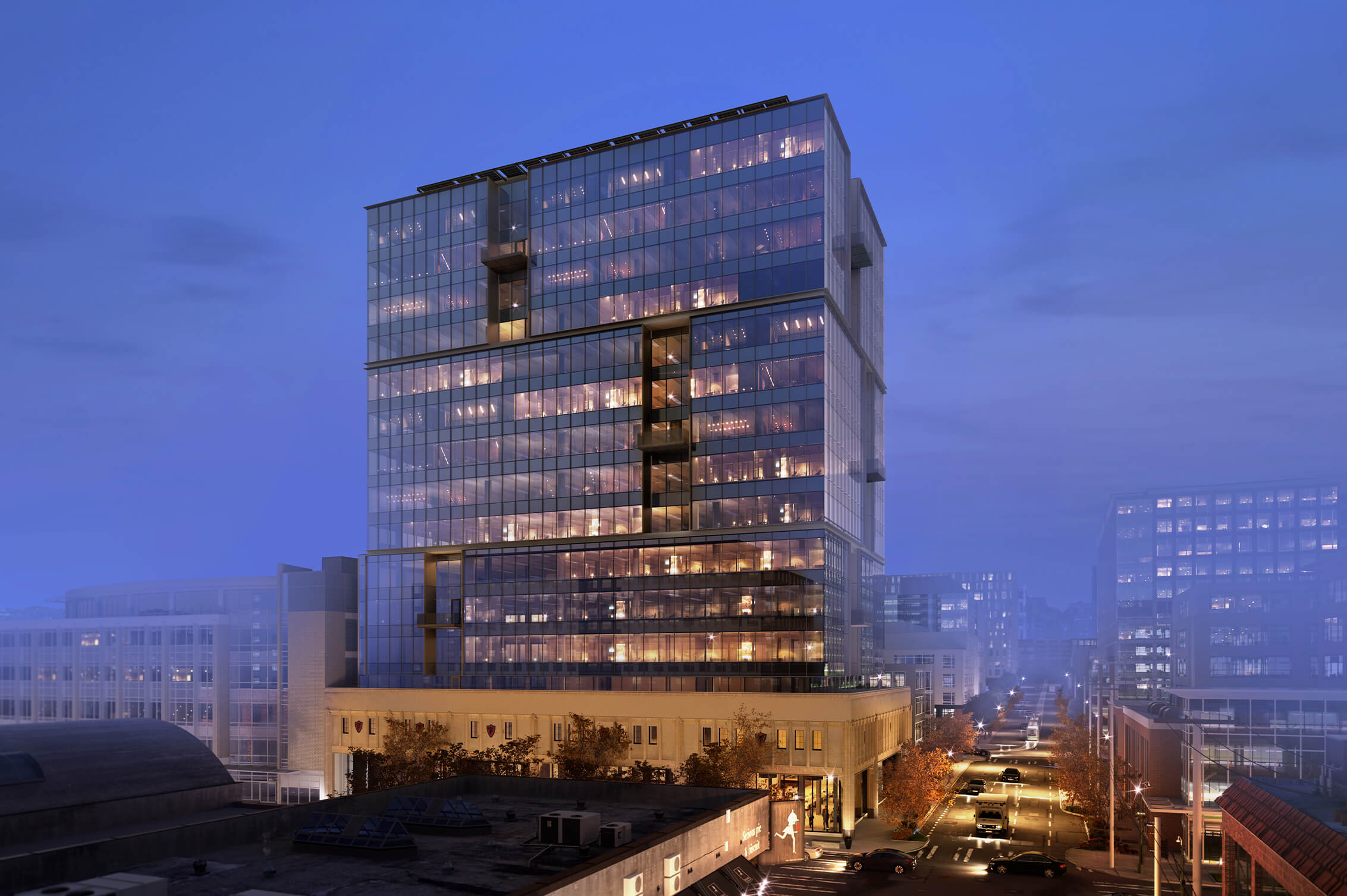 Glass office building at dusk viewed from above
