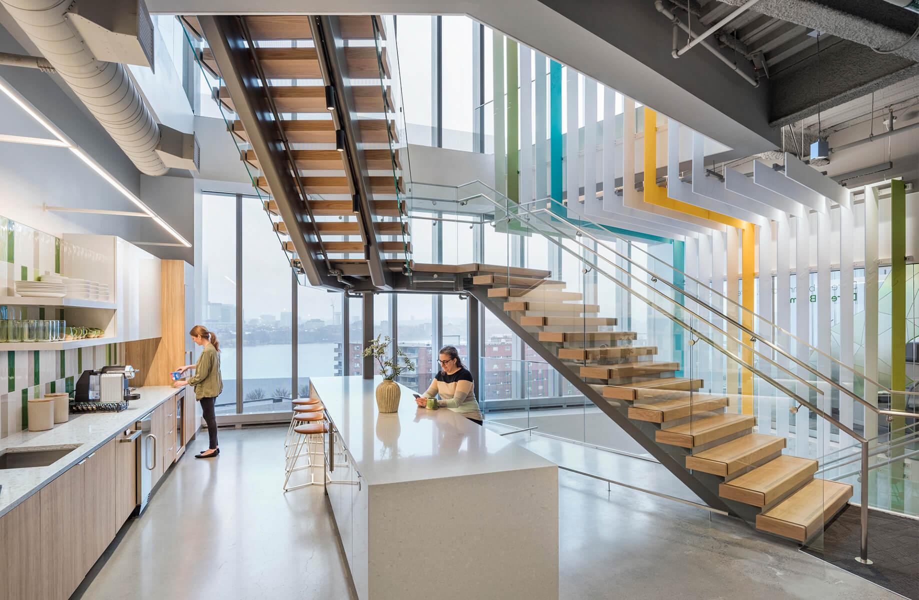 cafe area with people in it with large interconnecting stair