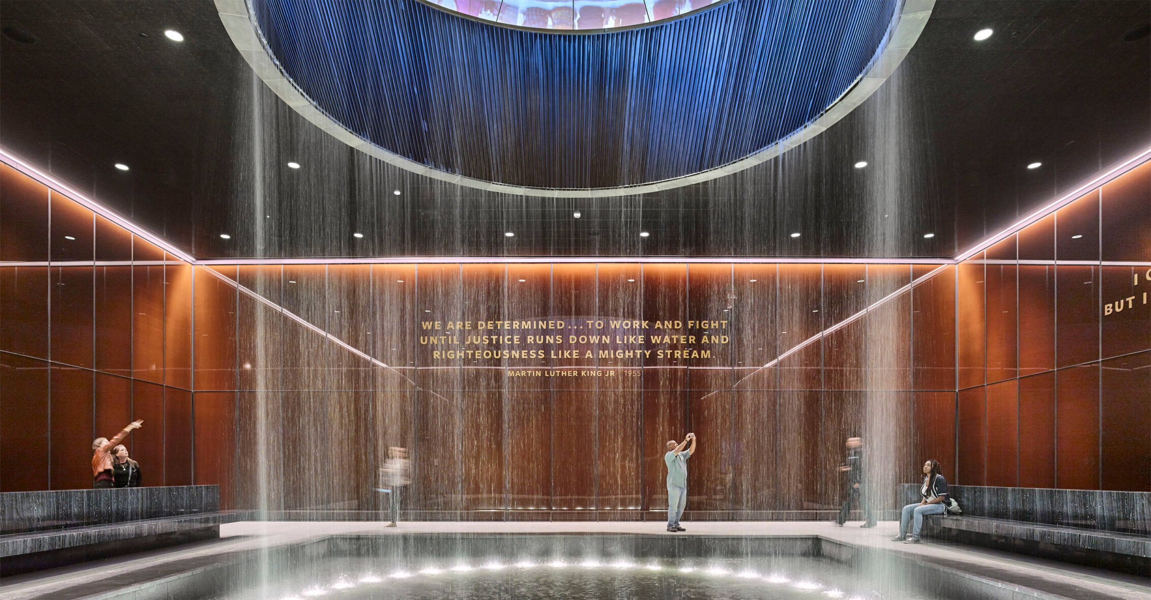 A photo of an indoor waterfall at the Smithsonian Institution, National Museum of African American History and Culture