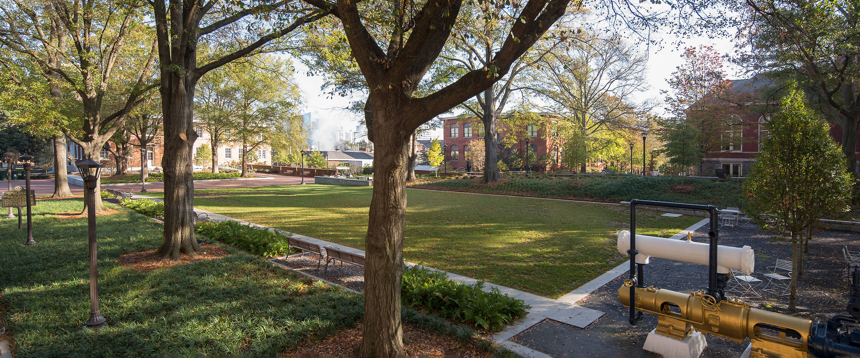 Looking northeast through the trees and across the lawn of Harrison Square