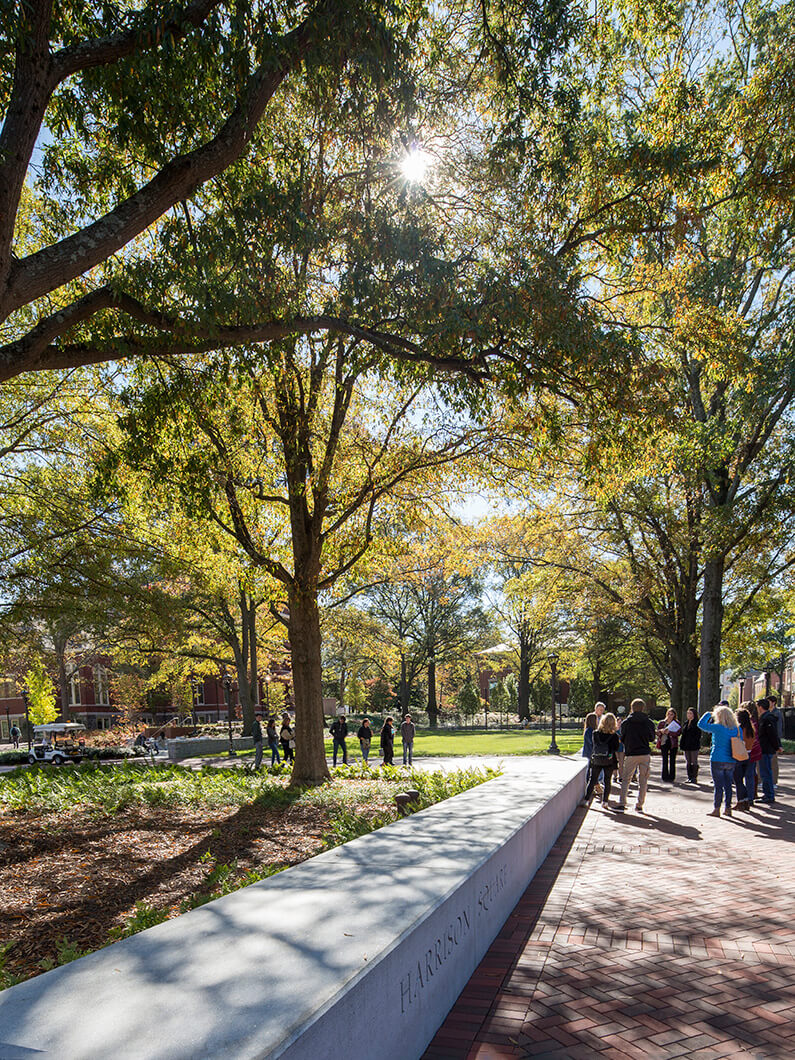 Looking west across Harrison Square as a tour group stops to learn about Tech Tower