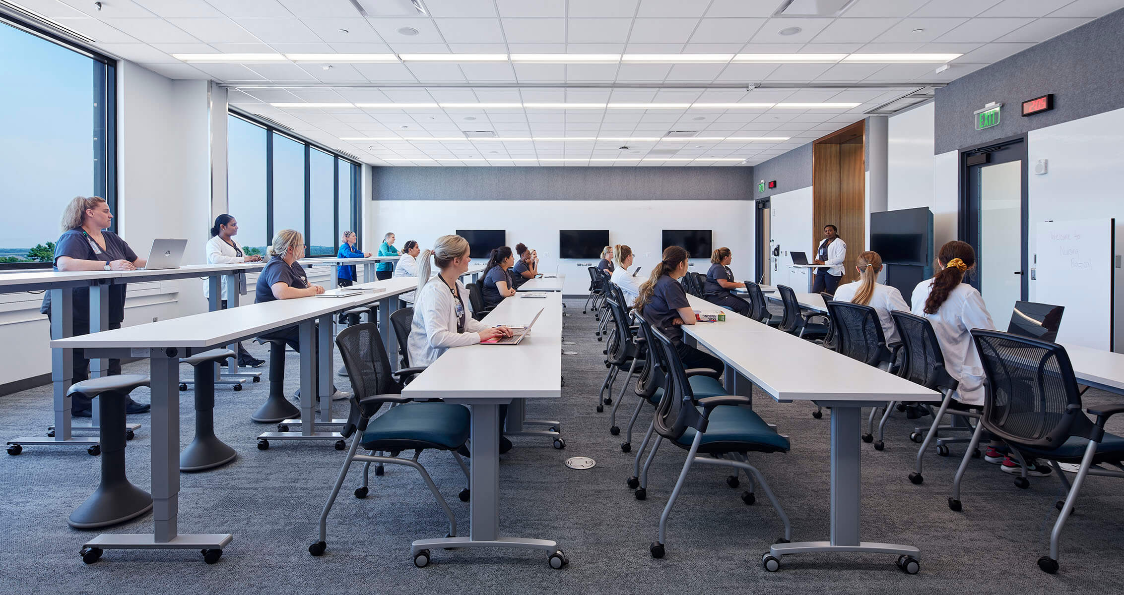 Photo of students in a flexible classroom that can be expanded to accommodate large groups.