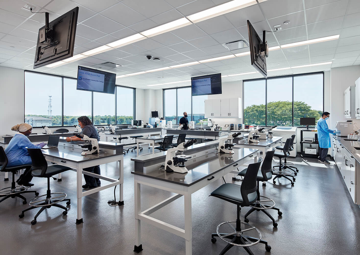 Photo of a lab classroom in a health sciences education building with monitors and cameras for remote learning