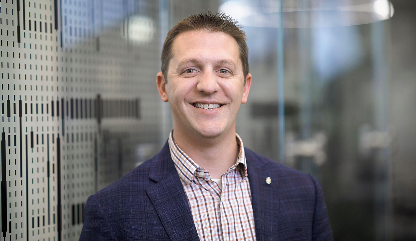Brad smiles in his headshot