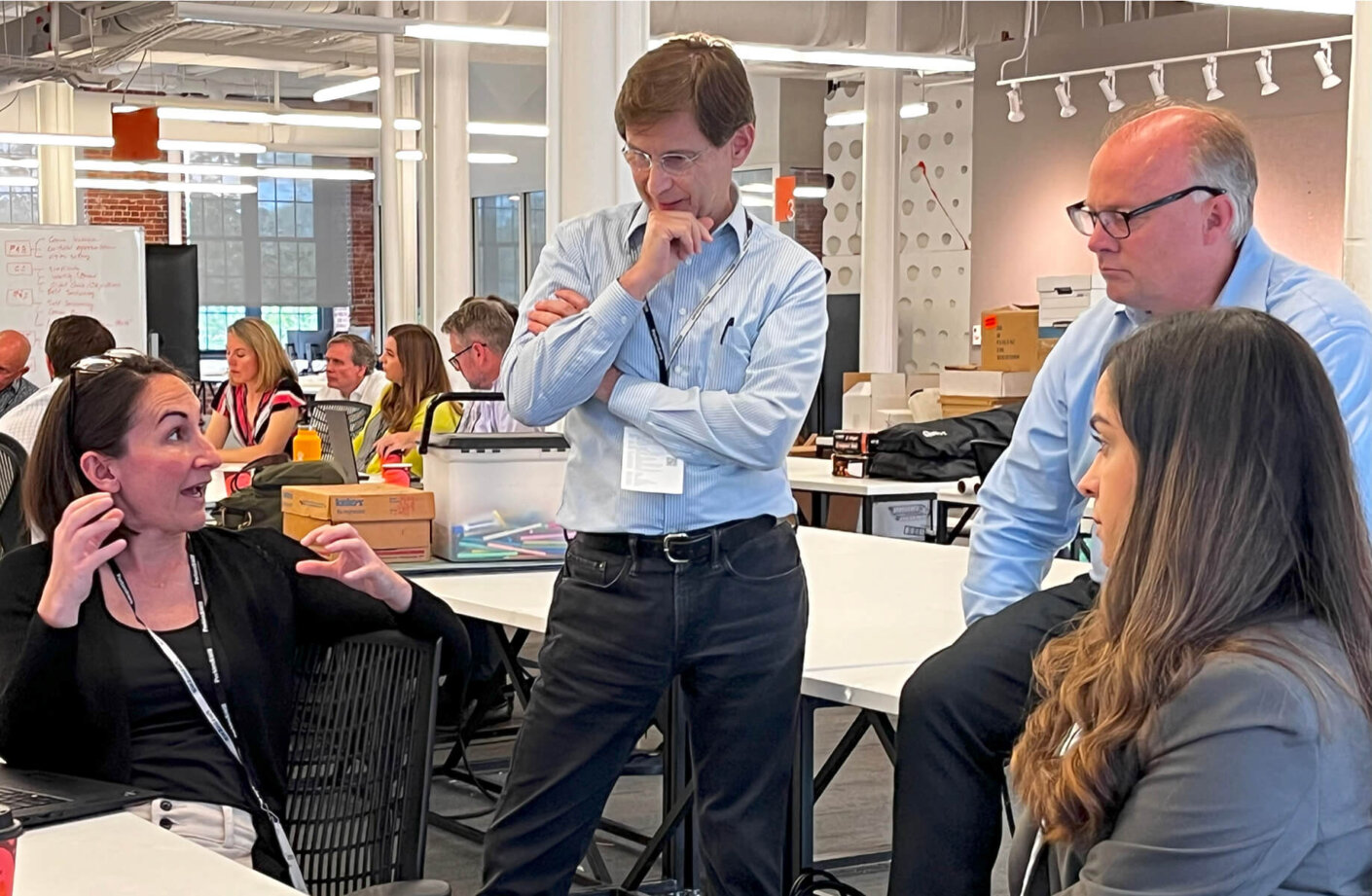 Eurico listening to a colleague during a design charrette