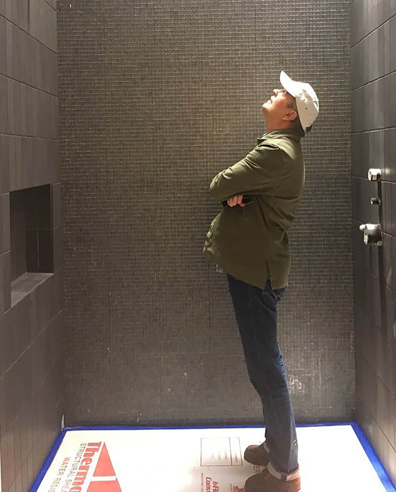 Peter Pfau investigating a shower.