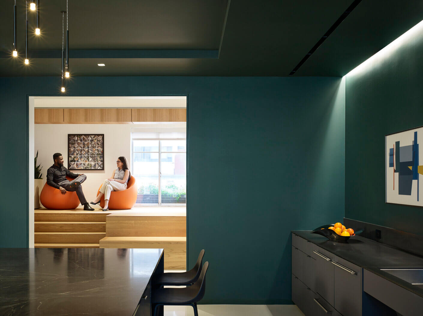 A relaxation room with dark blue walls.