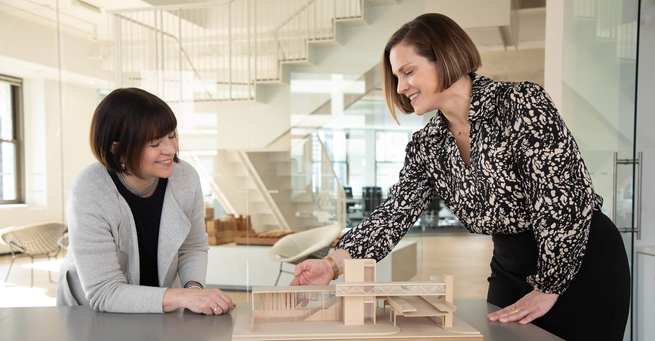 maragret and lindsey with a scale model of the damen green line station