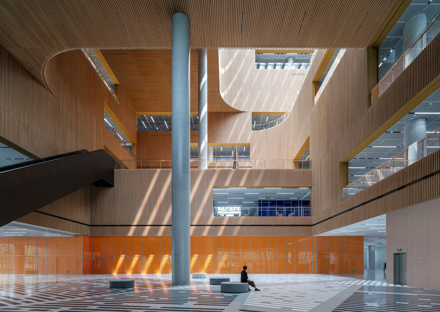 Modern architectural interior with wood, glass, and light play.