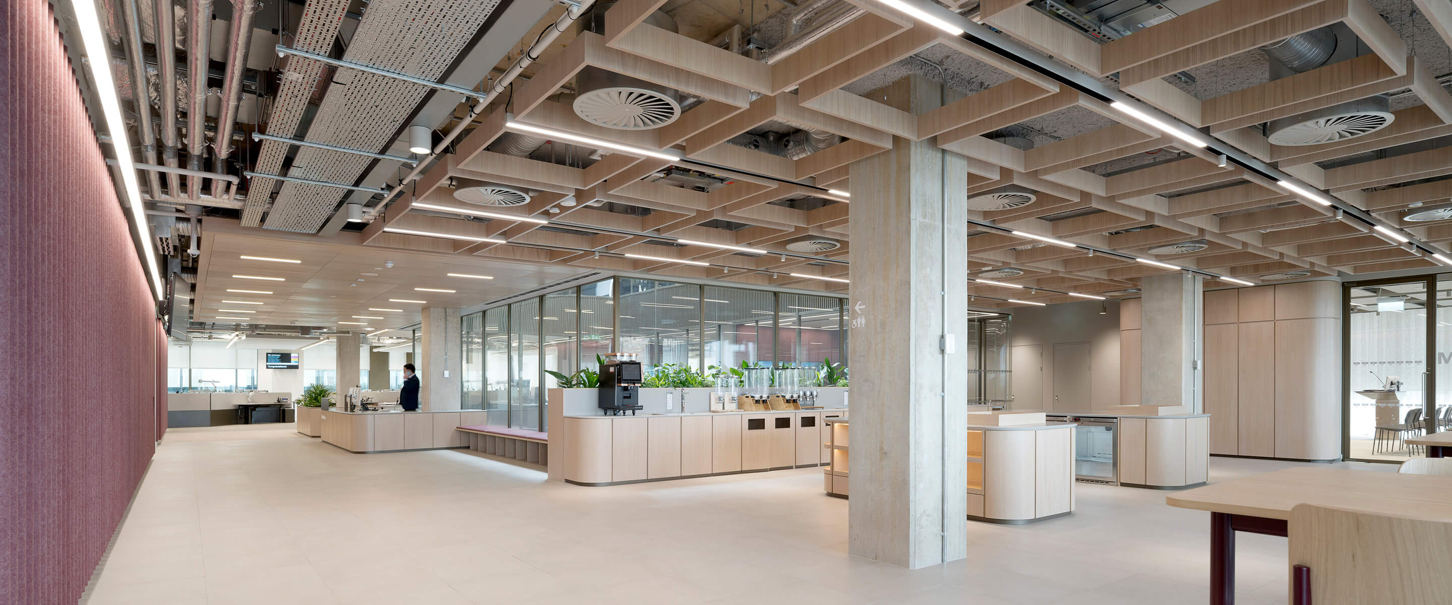 Modern office interior with open space and sleek wood design.
