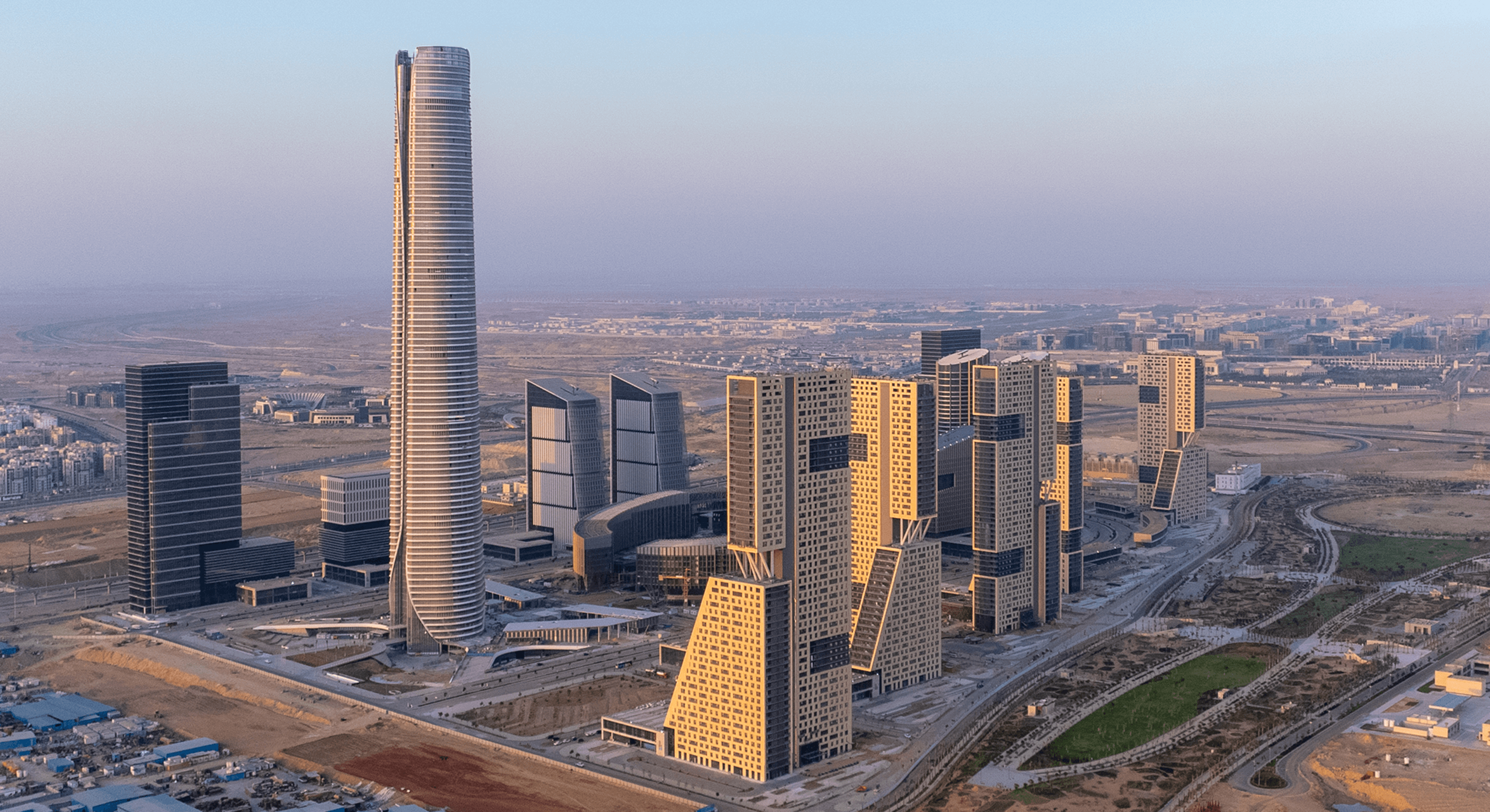 Futuristic skyscrapers and cityscape at sunrise in a modern urban development.