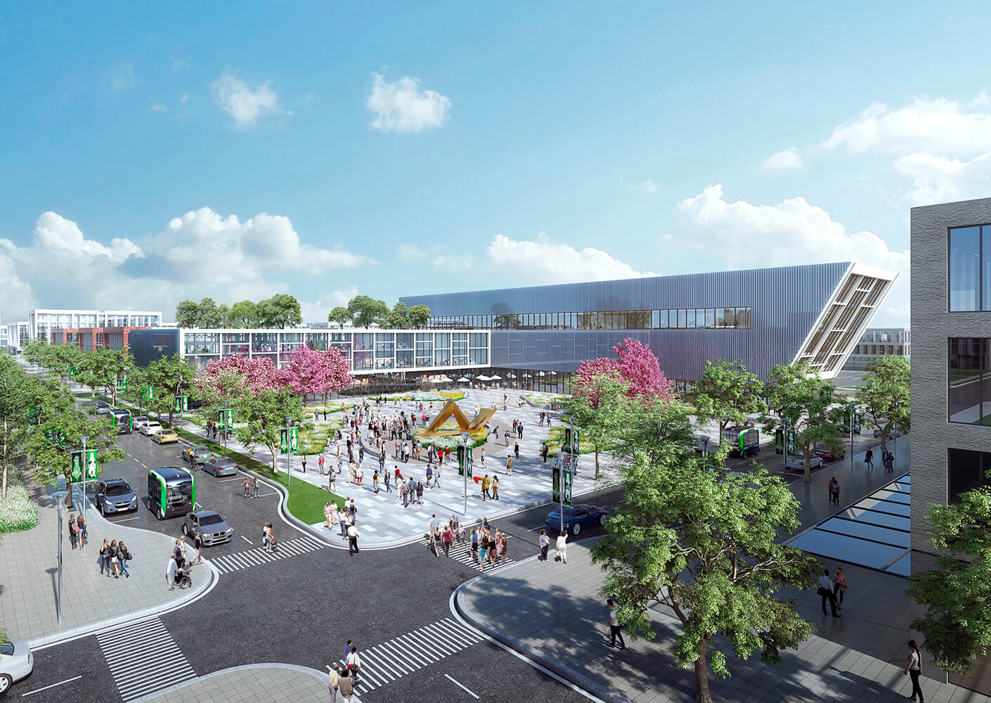 Modern campus plaza with trees, people, and buildings under a bright blue sky.