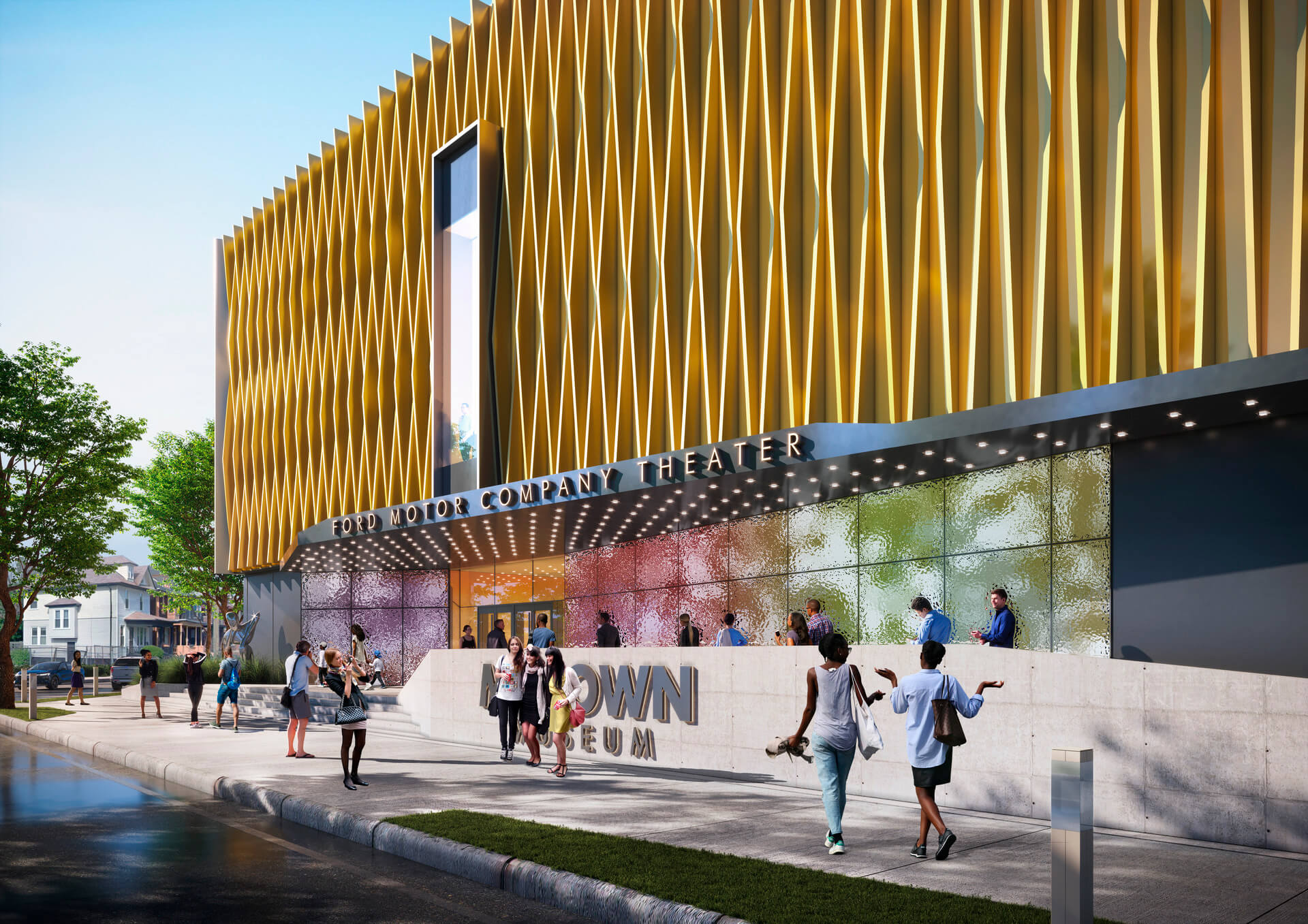 Modern theater entrance with golden facade, pedestrians and colorful wall decor.