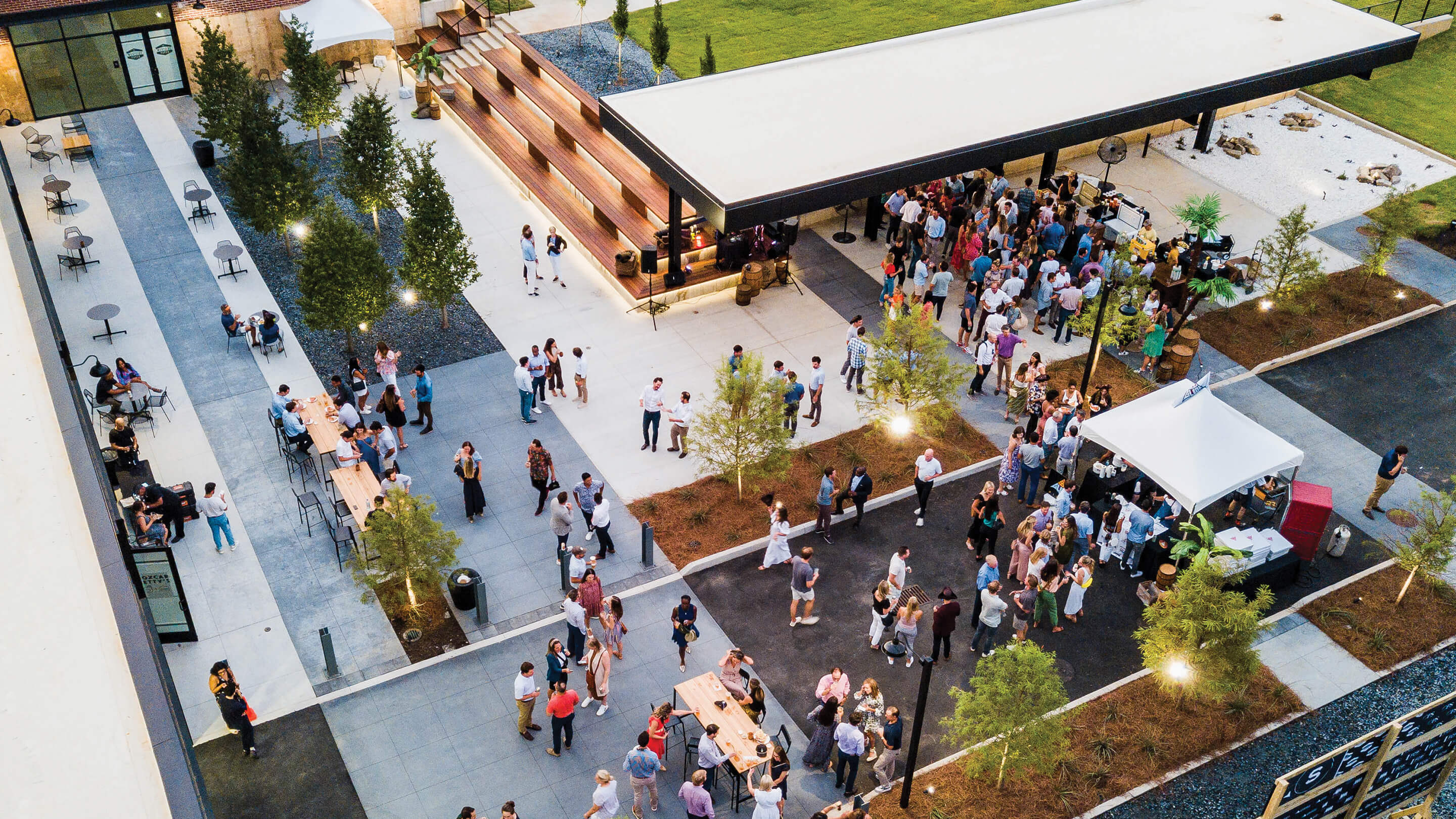 Aerial view of a lively outdoor event with people socializing.