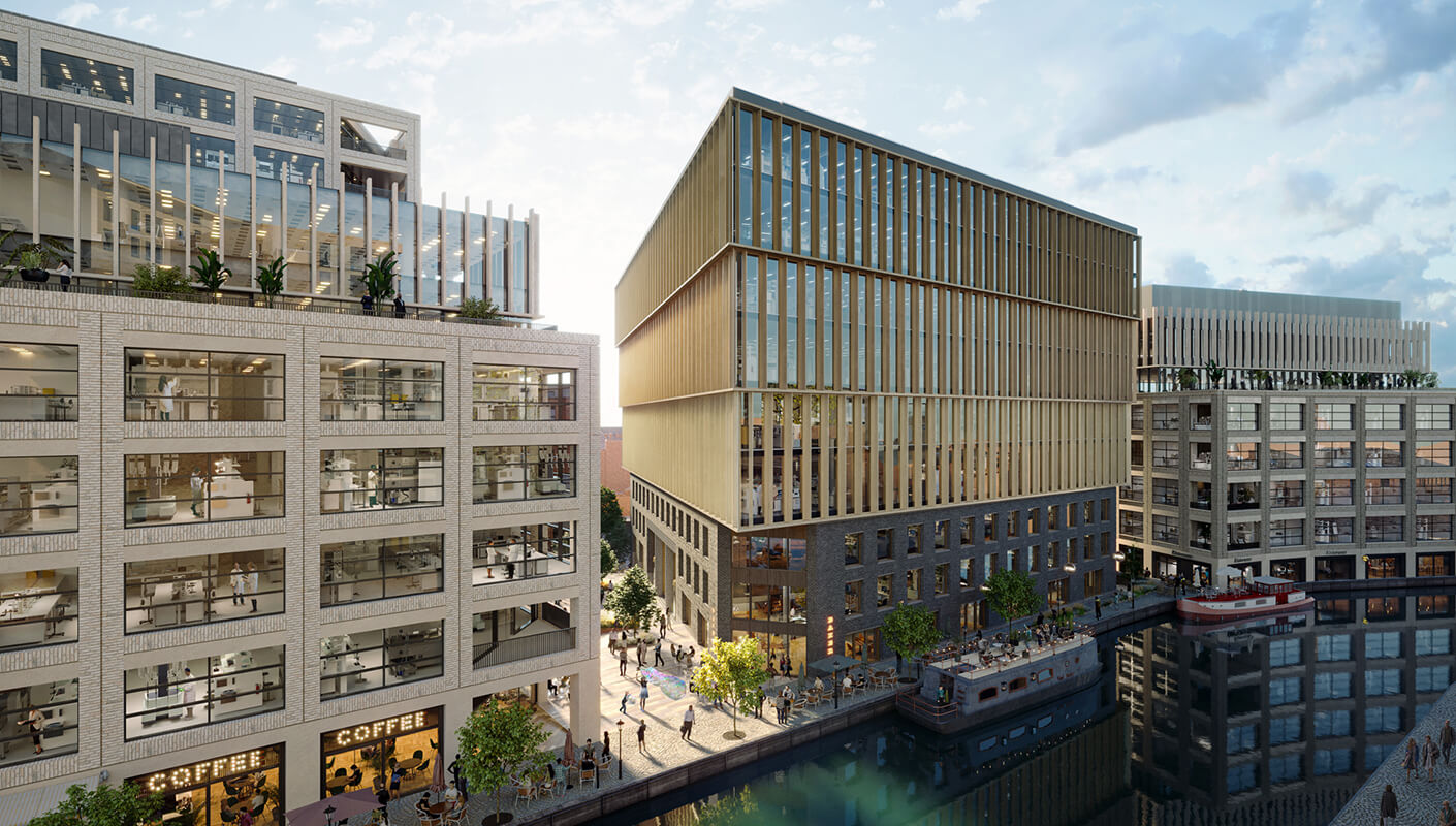 Modern office buildings along a riverside with people and cafes.