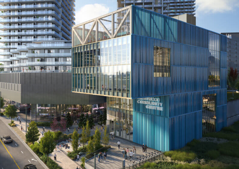 Modern community center with glass facade in urban development.