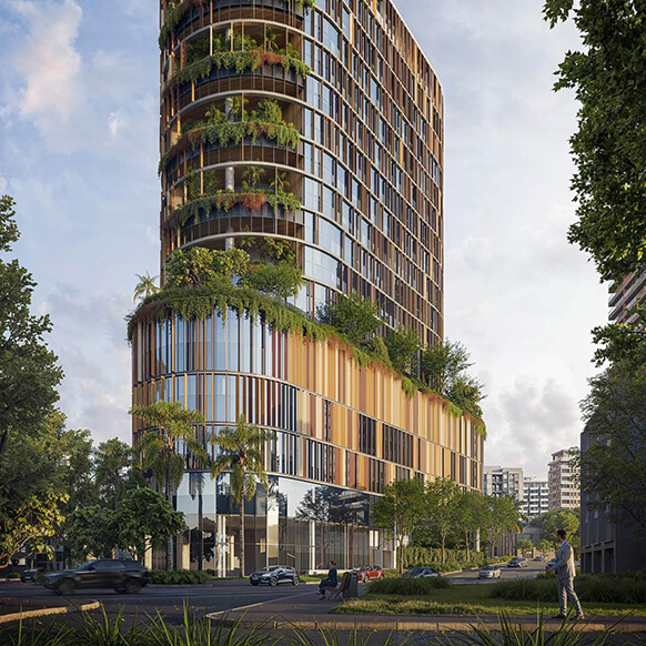 Modern eco-friendly skyscraper with lush greenery and urban surroundings.