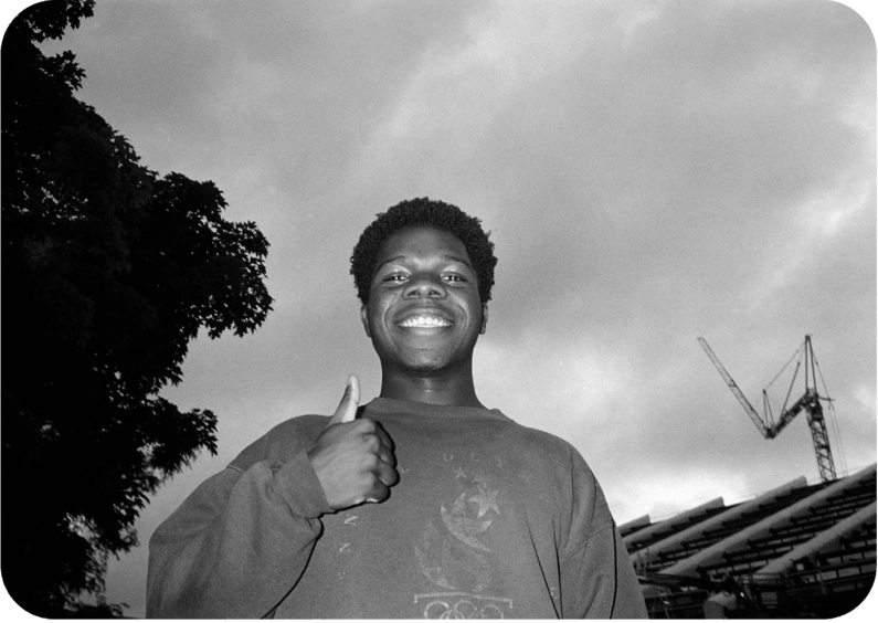 Donald smiling and giving a thumbs-up in black and white film image.