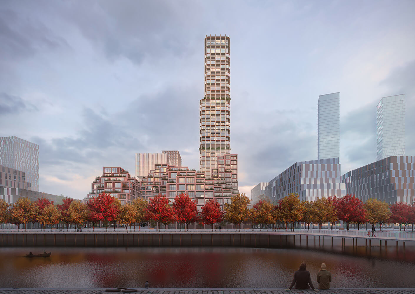 A rendering of a waterfront scene featuring a tall residential tower beside several clustered buildings, surrounded by autumn-colored trees and a calm waterway.