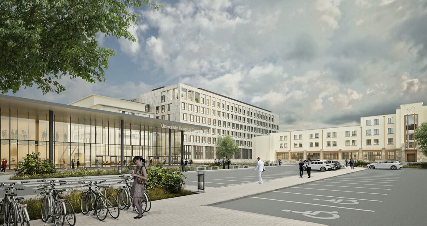 University Hospital Galway exterior with landscaped parking area and bicycle racks. People visible near the entrance and walking in the foreground.